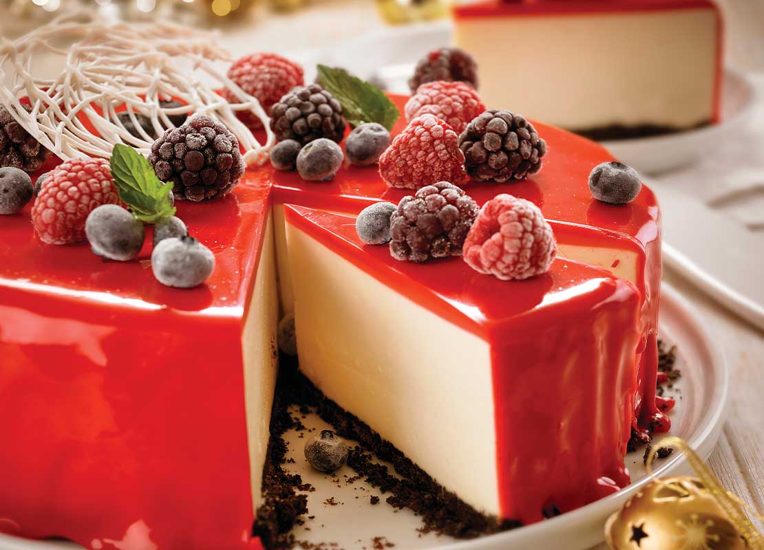 Cheesecake de frutos rojos navideño elaborado con productos LA LECHERA® para un evento de dayketing