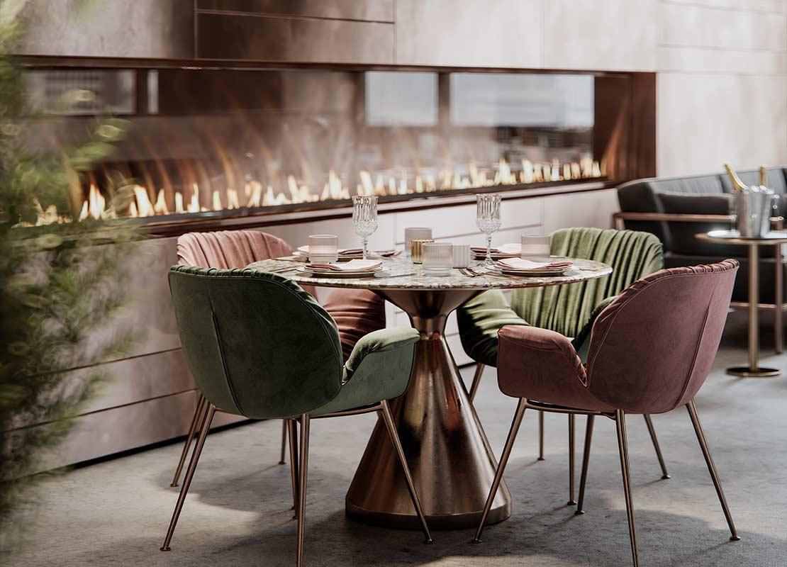 Mesa con cuatro sillas cómodas y bien iluminada por una lámpara gracias a la decoración de restaurantes y ambientación