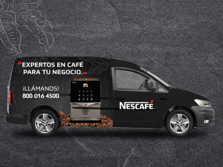 Furgoneta NESCAFÉ® de color negro con gráfico de máquina de café e información de contacto en su lateral.