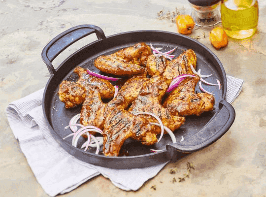 Alitas con salsa de mango habanero